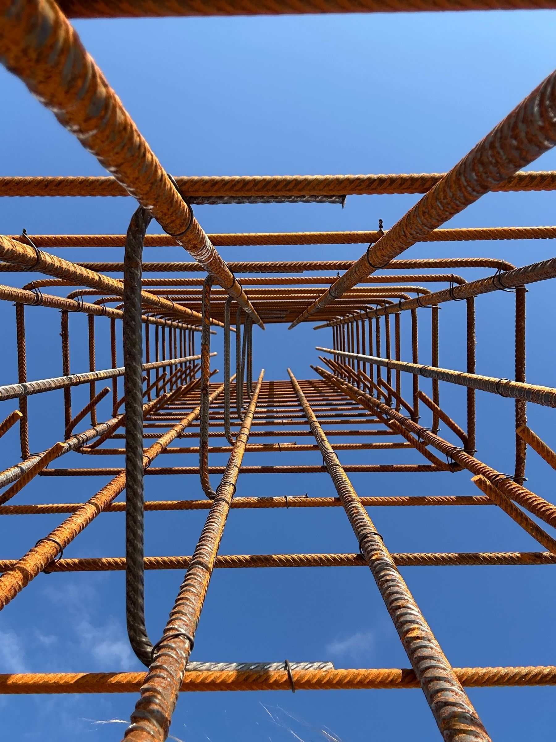 Steel reinforcing bars in a structure under construction